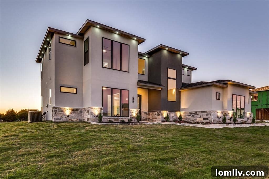 Expansive custom-built home in Red Oak, Texas, featuring a grand entrance and lush landscaping