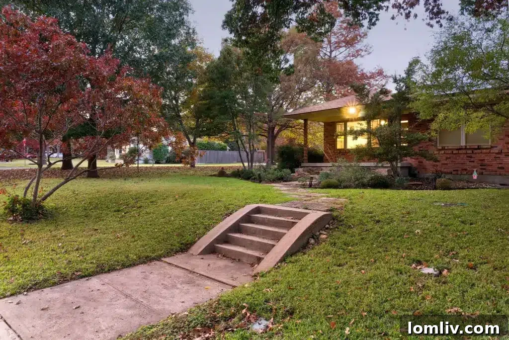 Wynnewood North Midcentury: A Tour of Its Irresistible Charms 3 Modern exterior of a Wynnewood North house with sleek lines, showcasing thoughtful landscaping and contemporary design elements.