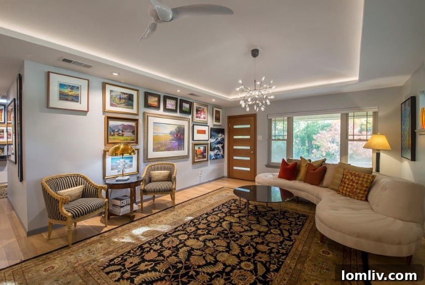 Wynnewood North Midcentury: A Tour of Its Irresistible Charms 5 Interior view of a modern living room with high ceilings, abundant natural light, and tasteful minimalist decor.