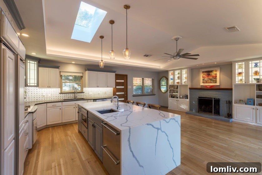 Wynnewood North Midcentury: A Tour of Its Irresistible Charms 7 Spacious dining area with modern light fixtures, a stylish dining table, and curated artwork, offering an elegant space for meals.