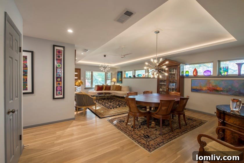 Wynnewood North Midcentury: A Tour of Its Irresistible Charms 9 Contemporary kitchen island with stylish pendant lights, ample counter space, and integrated appliances, perfect for culinary endeavors.