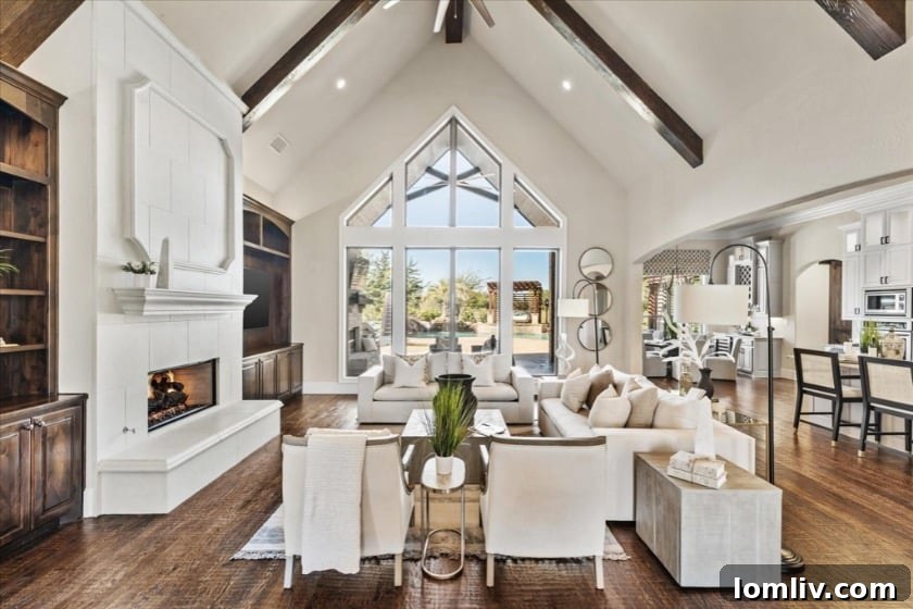 Black Hills Willow Springs Heath The City of Many Aliases 5 Interior view of the living room with soaring cathedral ceilings and large windows offering abundant natural light and views of the backyard.