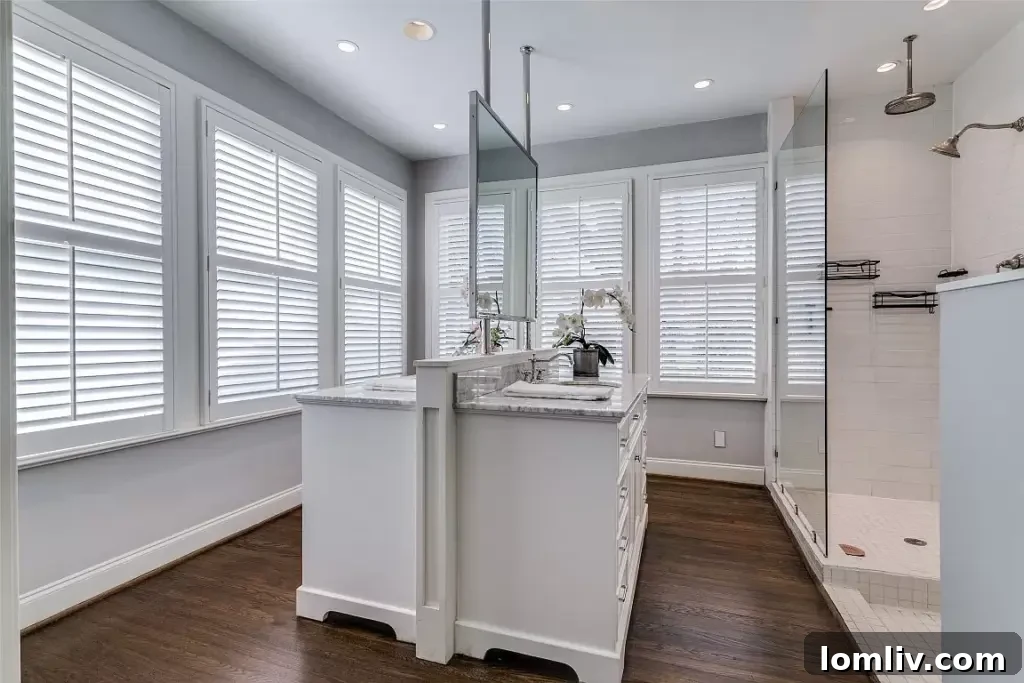 Ensuite bathroom with a contemporary vanity, classic tilework, and marble accents.