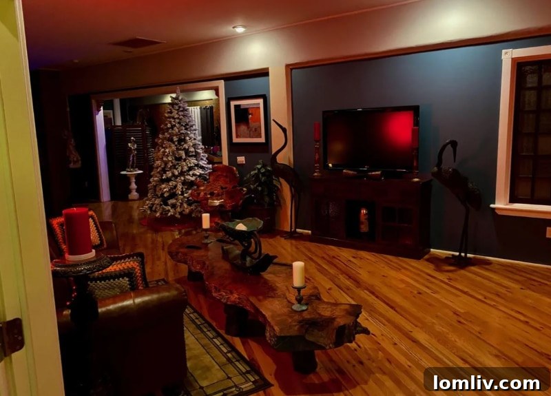 Decorated Christmas tree in a dark-themed living room