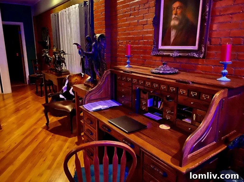 Elegant study room with dark decor and antique desk