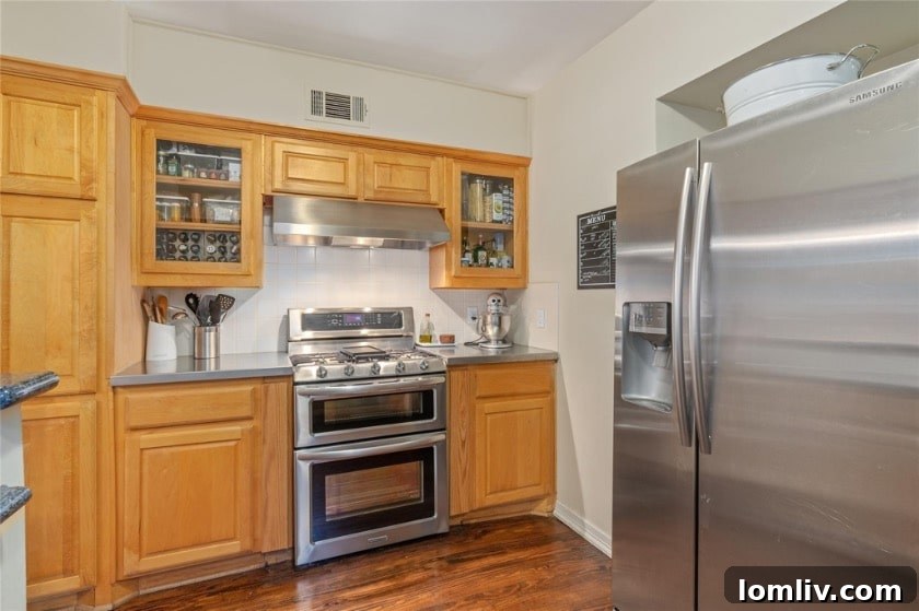 Stylish kitchen area with modern appliances blended seamlessly into the historic aesthetic of the duplex.