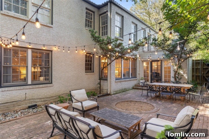 Charming courtyard entrance of the Spanish Colonial Revival duplex with intricate details and greenery.