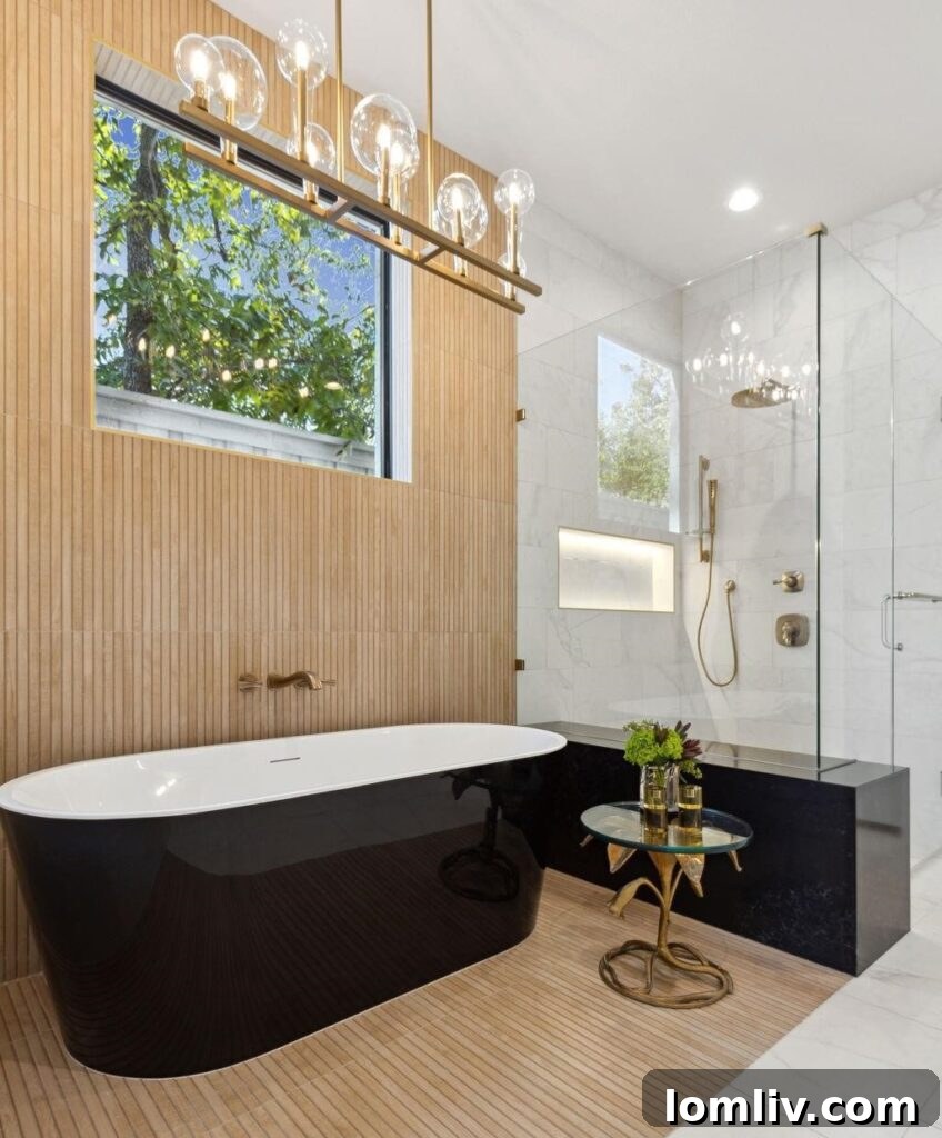 Detailed view of elegant primary bathroom vanity with brushed gold fixtures