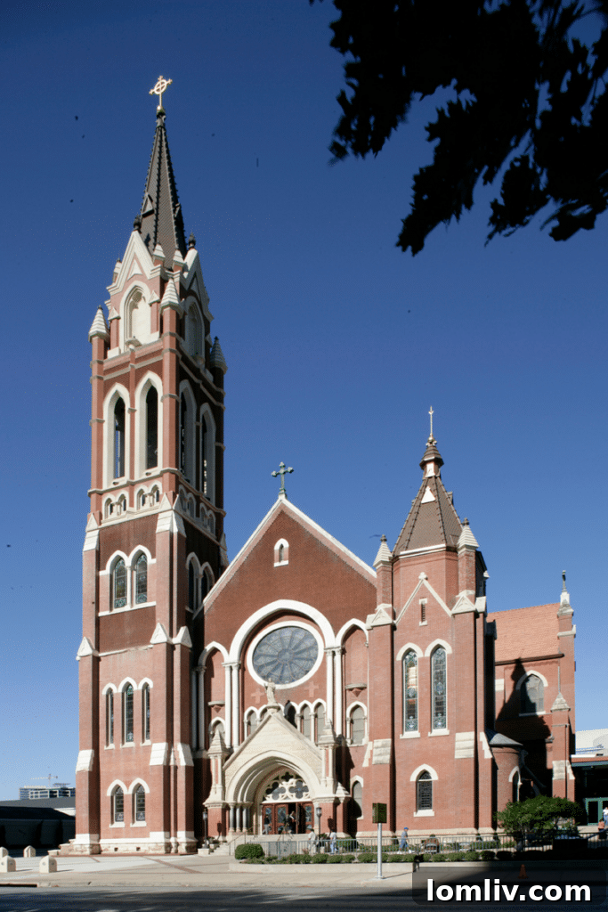 Detailed view of Cathedral Guadalupe's steeple against the Dallas sky