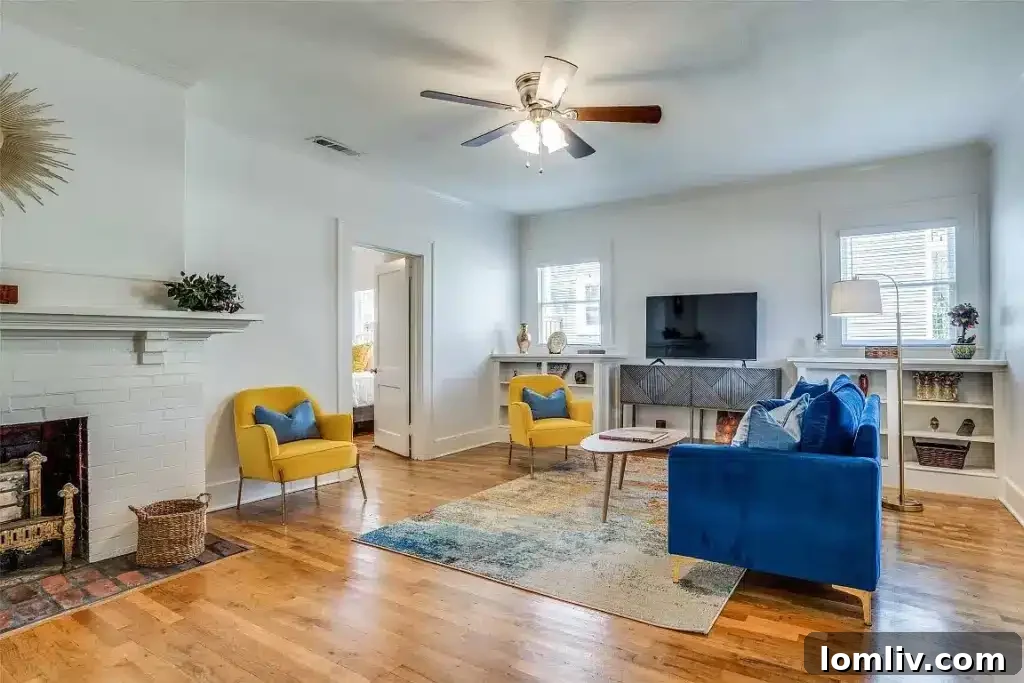Inviting living room interior of the Craftsman duplex, showcasing original built-ins and abundant natural light.