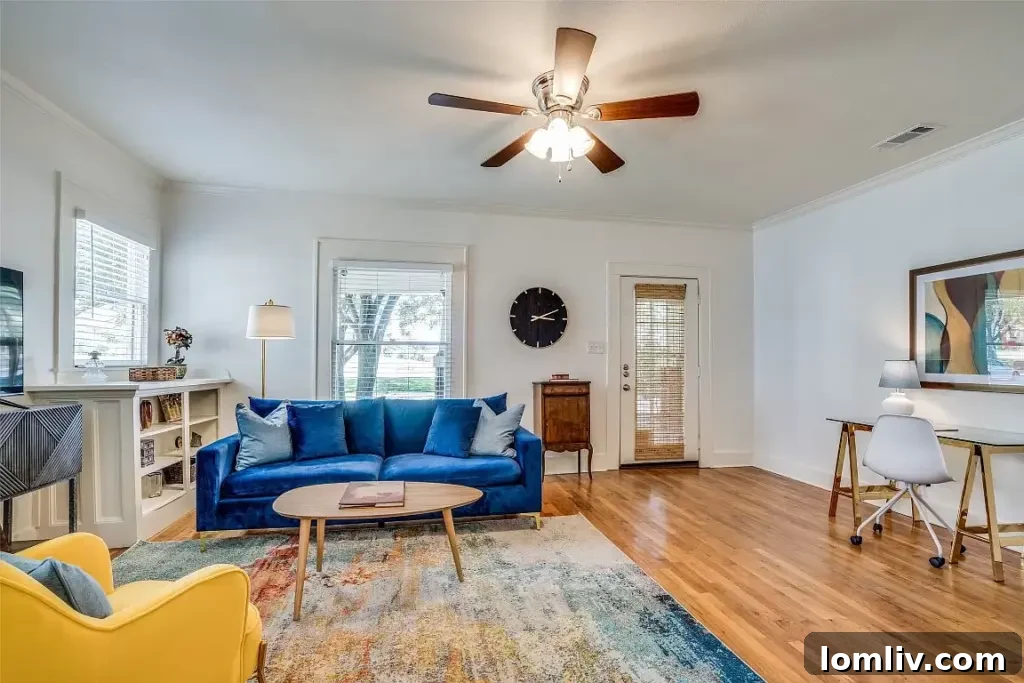 Bright and spacious living room, featuring a large window and classic architectural details.