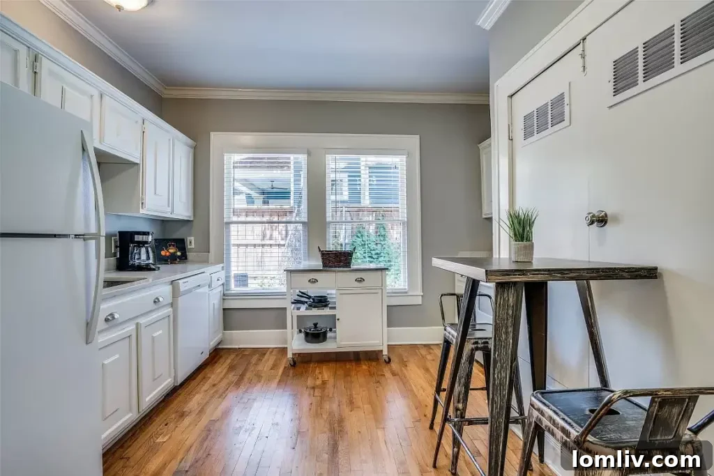 Functional and charming kitchen with essential appliances and ample cabinet space.