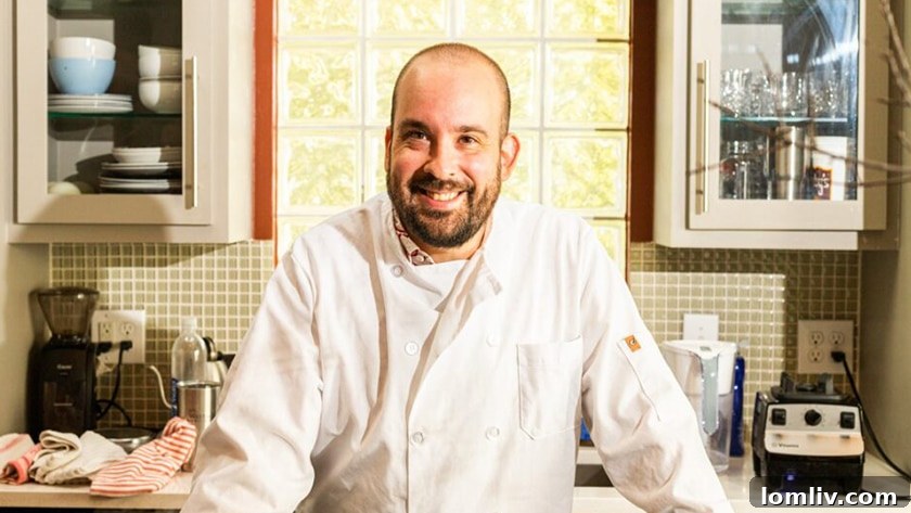 Chef Clayton Kahler Brown passionately preparing a meal, blending his culinary and artistic talents.