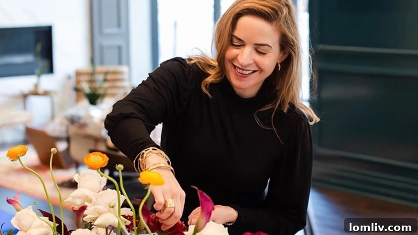 Claire Rathbun, a talented floral designer, meticulously crafting a stunning arrangement.
