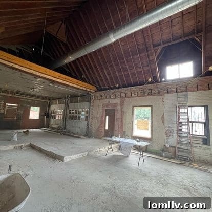 Workers on site during the renovation, showcasing the scale of the adaptive reuse project.