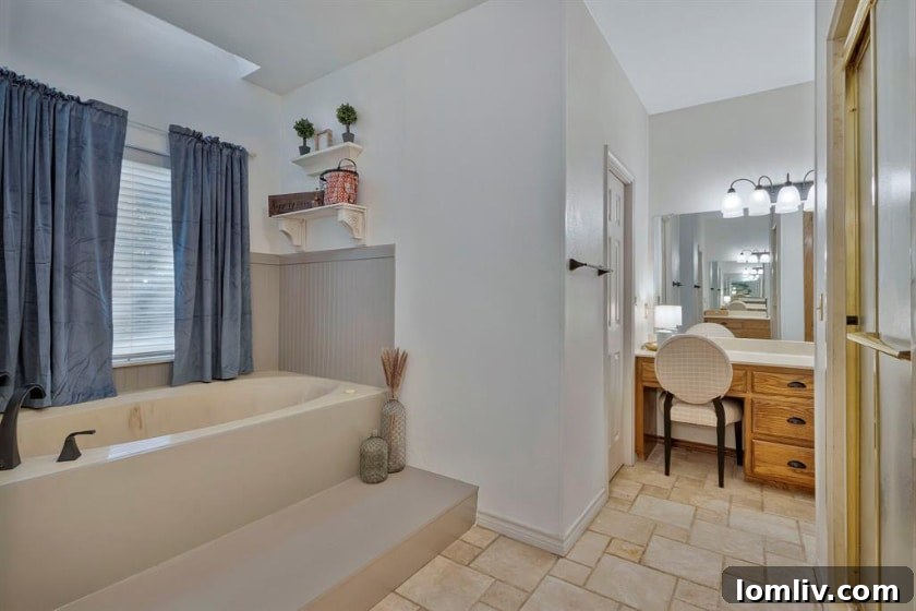 RE/MAX DFW Associates Liz Snowden Uncovers a Prime Flower Mound Property 11 Elegant bathroom with dual vanities and modern fixtures
