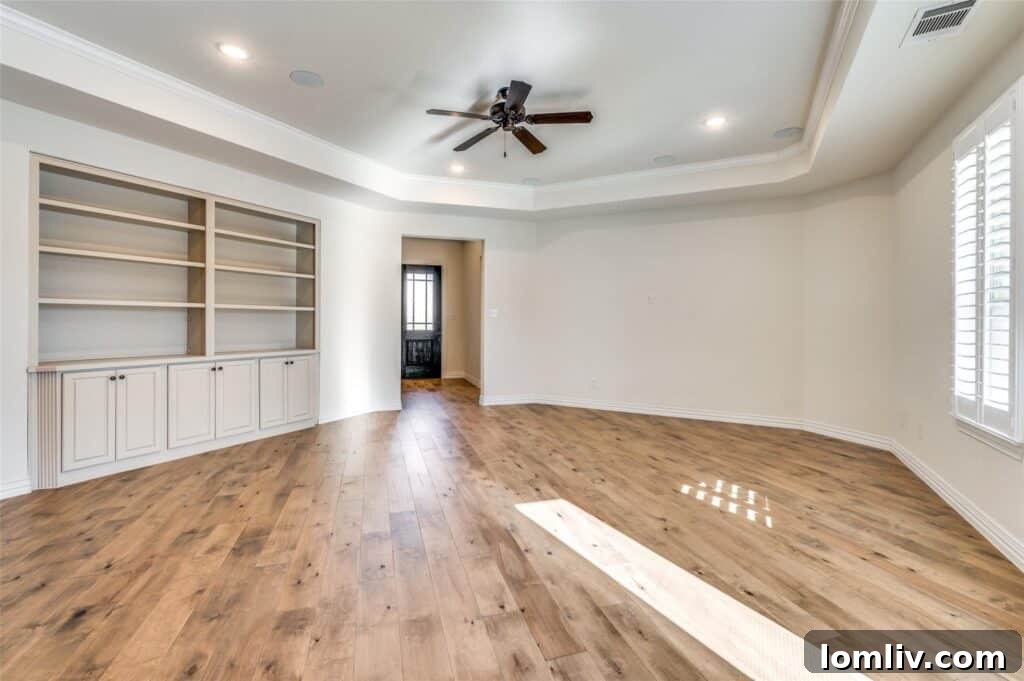 Inviting living room with ample natural light, showcasing comfort and style.