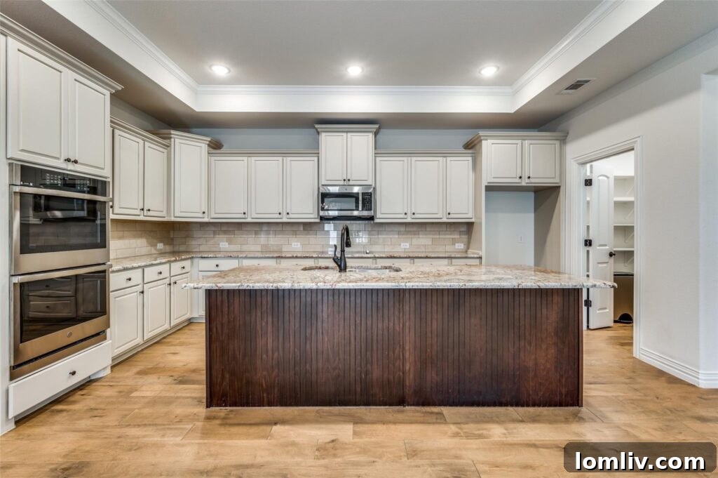 Modern kitchen with island seating, ideal for entertaining.