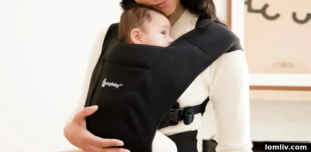 62 Lucrative Products Dominating 2024 Sales 53 A parent carrying a baby comfortably in an ergonomic baby carrier
