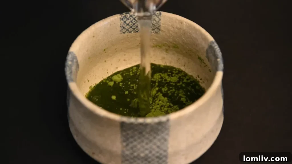 62 Lucrative Products Dominating 2024 Sales 64 A vibrant green bowl of matcha tea with a whisk
