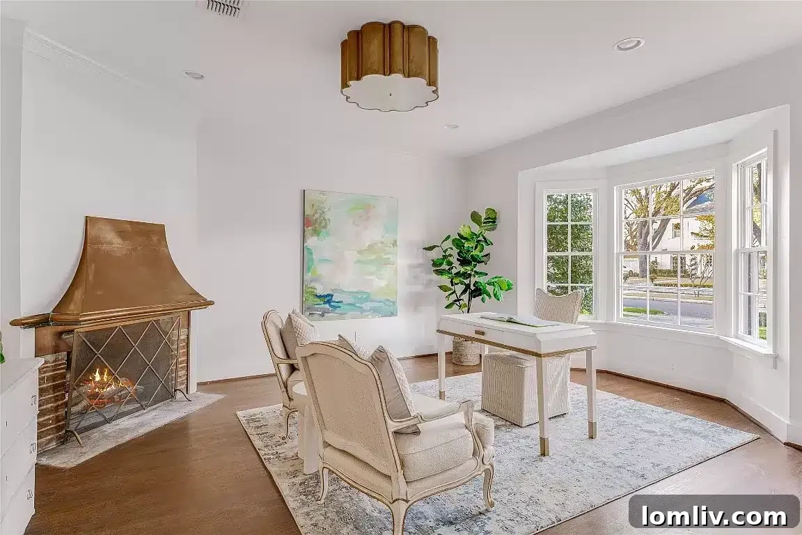 Elegant home office with fireplace and large windows