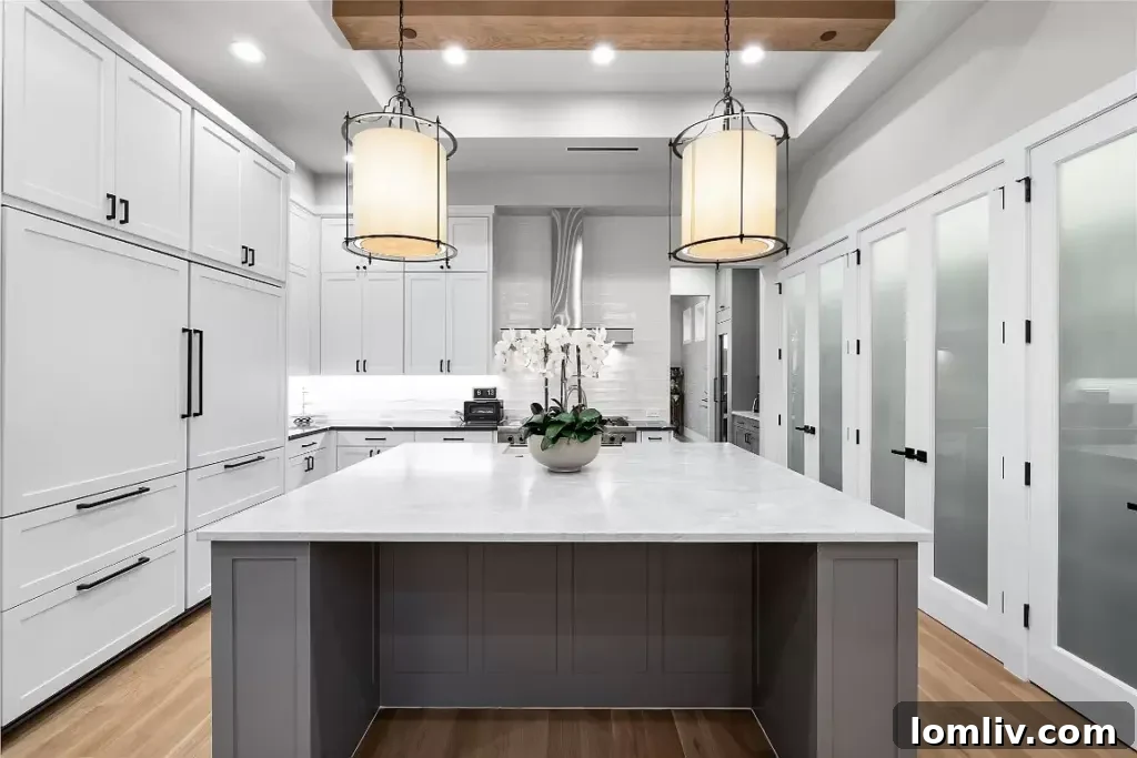 Modern kitchen with a large island, stainless steel appliances, and ample counter space.