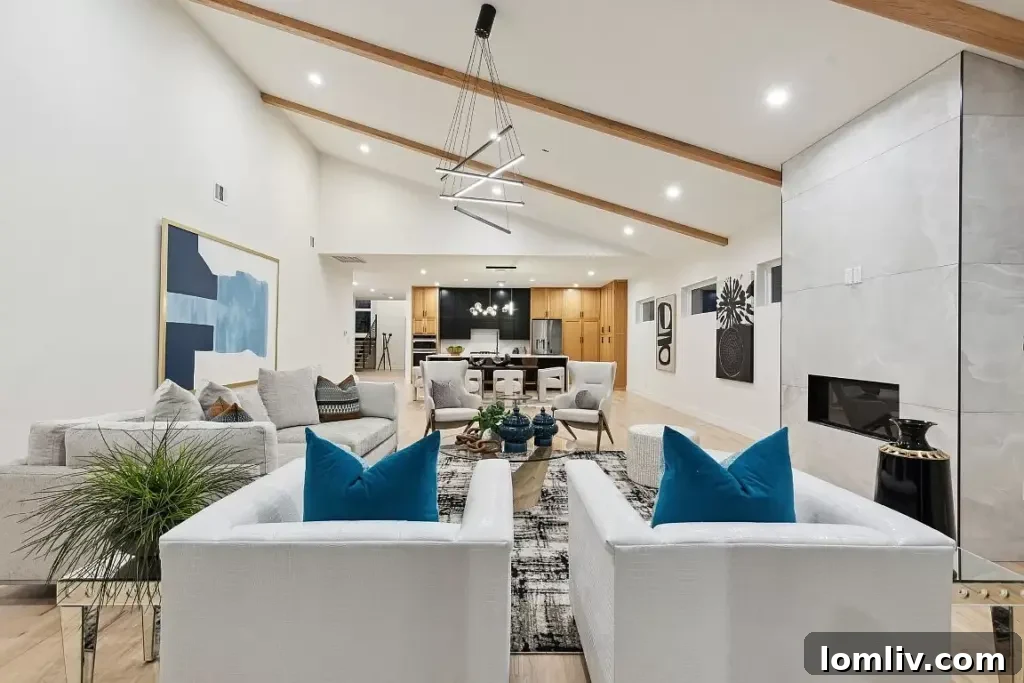 Dallas Designer Adriana Meyer Unveils Her Fabulous New Masterpiece 4 Spacious open-concept living room with high ceilings and a stone fireplace