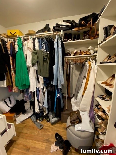 A cluttered closet with clothes overflowing and unorganized, representing a 'before' scenario.
