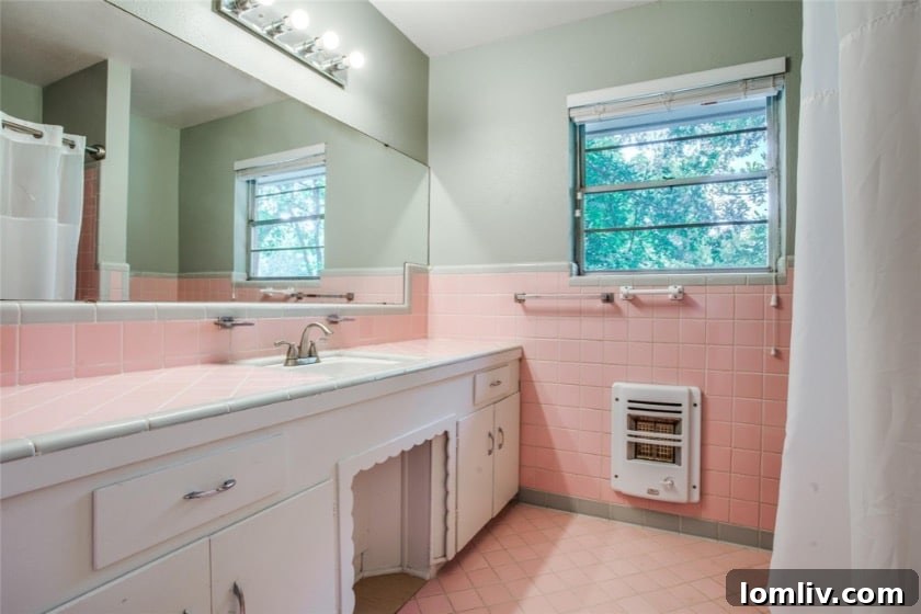 A stylish guest bathroom featuring a unique botanical wallpaper, a floating vanity, and penny tile on the walls.