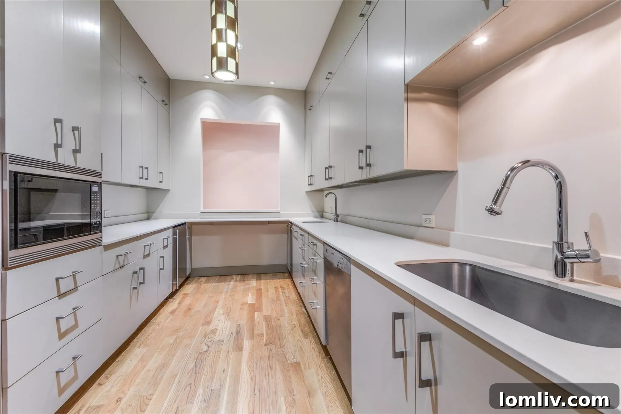 Professional catering kitchen with serving window, ample counter space, and modern appliances, perfect for large events