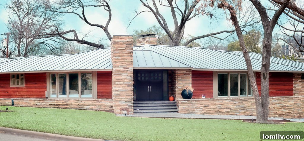 A charming, single-story Mid-Century Modern home at 7405 Kenshire, with a well-maintained lawn and mature trees, characteristic of North Dallas neighborhoods. This home is a featured property in the upcoming Northaven Home Tour.
