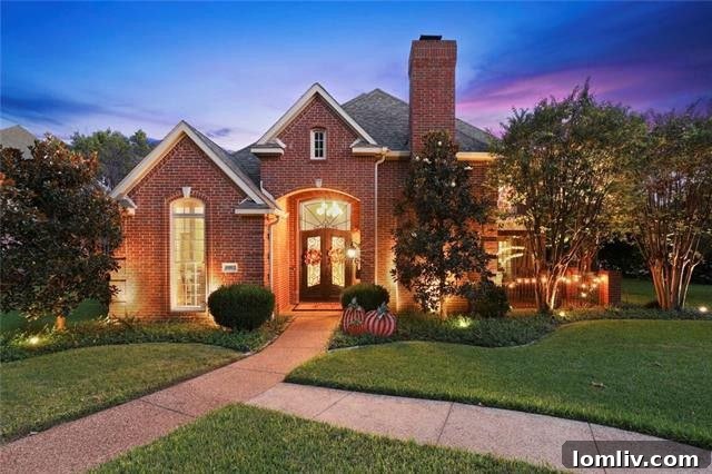 Exterior of the updated two-story home at 10812 Aladdin Dr, Disney Streets Dallas
