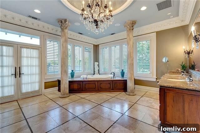 Luxury master bathroom with dual vanities and opulent finishes
