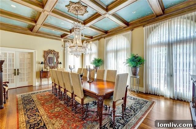 Formal dining area with fireplace and French doors in The Baldridge House