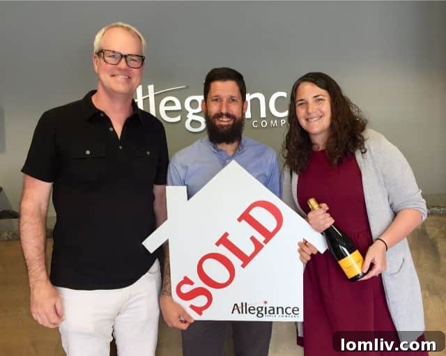 Realtor Paul Sanders with happy clients after closing