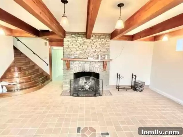 Basement fireplace with laminate flooring, Monticello Tudor home