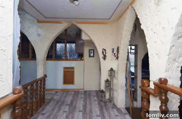 Interior with handrails and multi-level flooring, enhancing safety and unique design