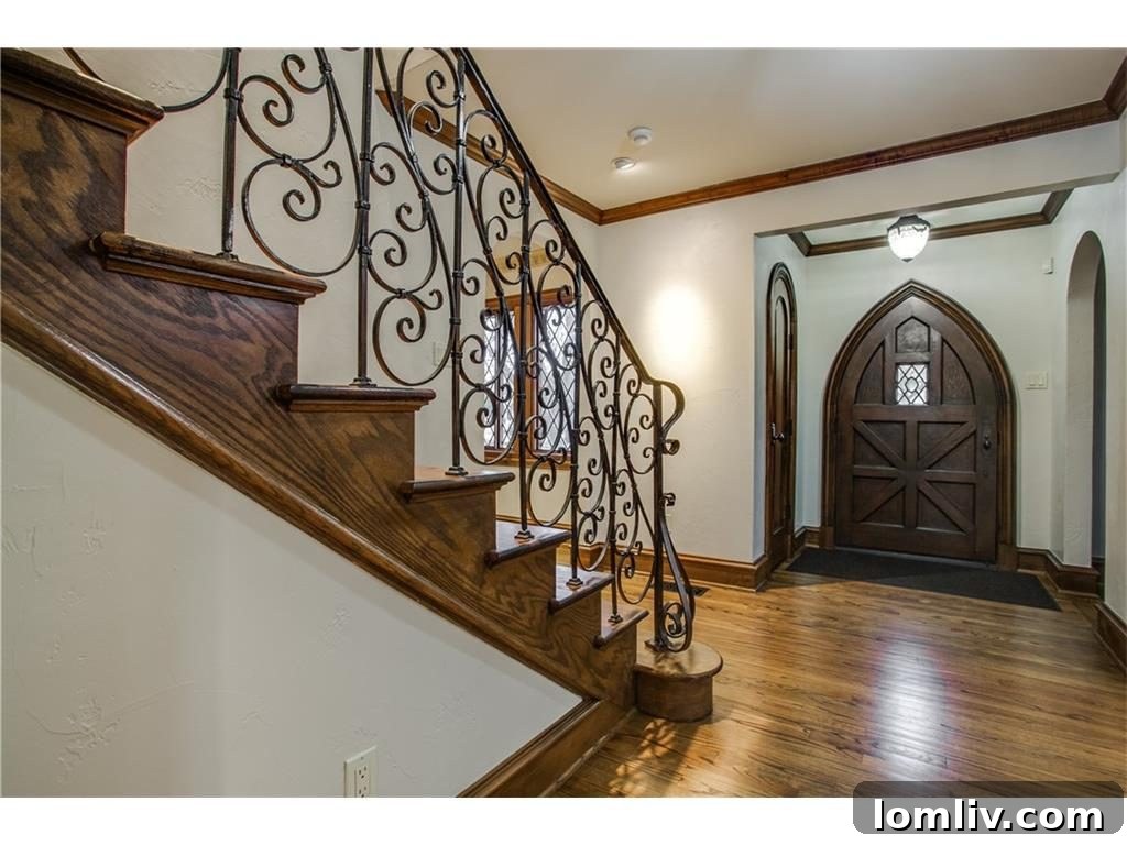 Grand entrance of the Iconic Lakewood Estate by Charles Dilbeck featuring updated bannister.