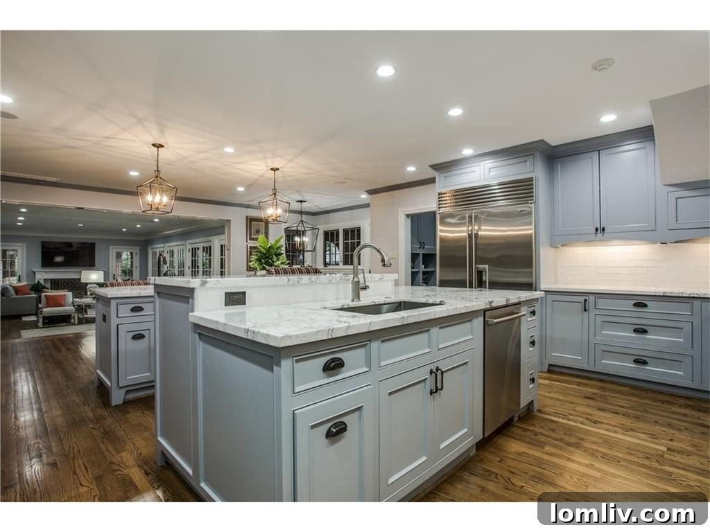 Another view of the renovated kitchen with high-end appliances in the Lakewood estate.