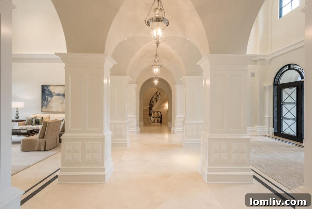 Luxurious living room interior featuring elegant furnishings, high ceilings, and abundant natural light in a custom home by Bella Custom Homes