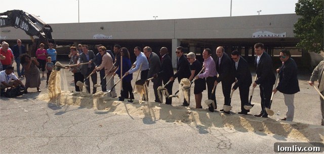 Civic leaders participate in the ceremonial sand toss at the Dallas Midtown groundbreaking event.