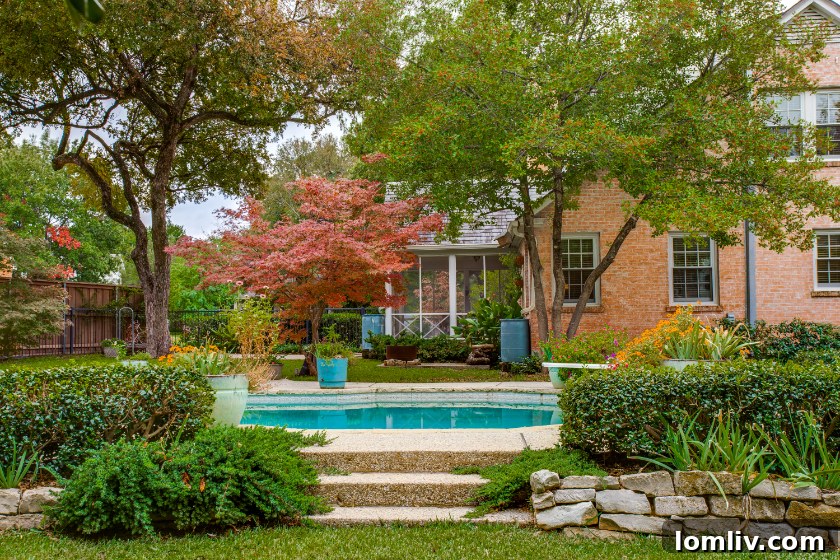 Spacious New England Colonial home with a large, inviting front yard and traditional entryway.