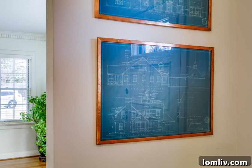 Original architectural blueprints by Hal O. Yoakum displayed in a Stevens Park Colonial home.