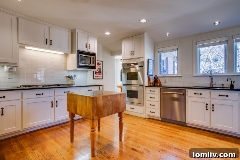 Lush, landscaped backyard of a New England Colonial home, perfect for entertaining.