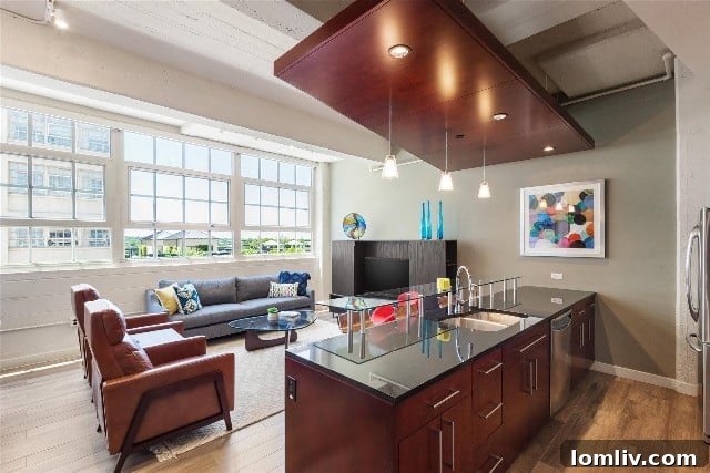 Montgomery Plaza Condos: Unbeatable Location, Unwavering Demand 7 Modern open-concept living space in a Montgomery Plaza condo, perfect for entertaining or relaxing.