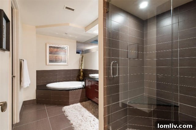 Montgomery Plaza Condos: Unbeatable Location, Unwavering Demand 8 Luxurious bathroom in Montgomery Plaza condo, offering options for a relaxing bath or invigorating shower.