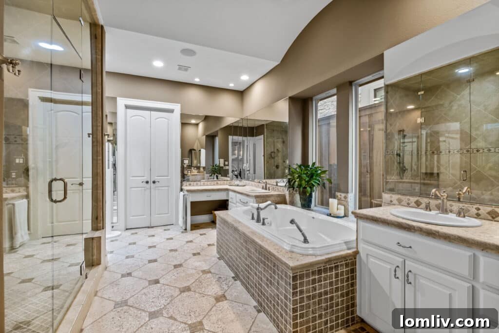 Luxurious primary bedroom with fireplace, tray ceiling, and backyard access