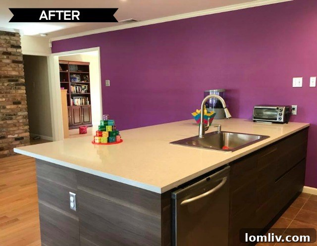 Lina Betancourt Fensch smiling in her new, vibrant kitchen, showcasing the purple accent wall.