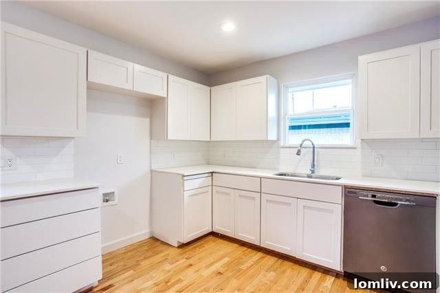 Expansive wooden deck and lush backyard with mature trees and a new cedar privacy fence