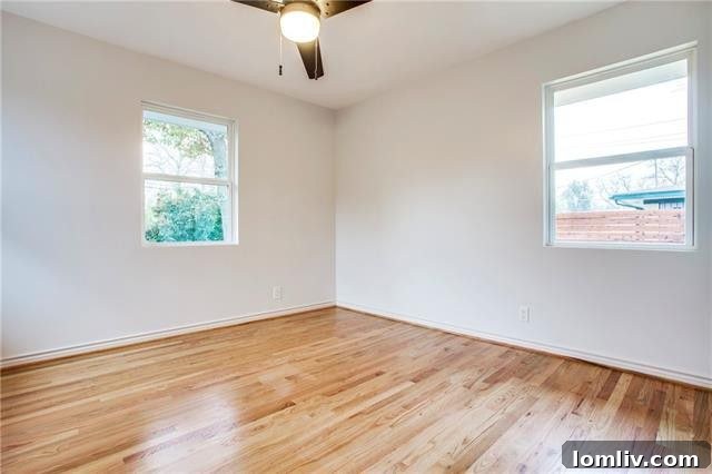 Another perspective of the spacious backyard deck, ideal for outdoor living in East Dallas